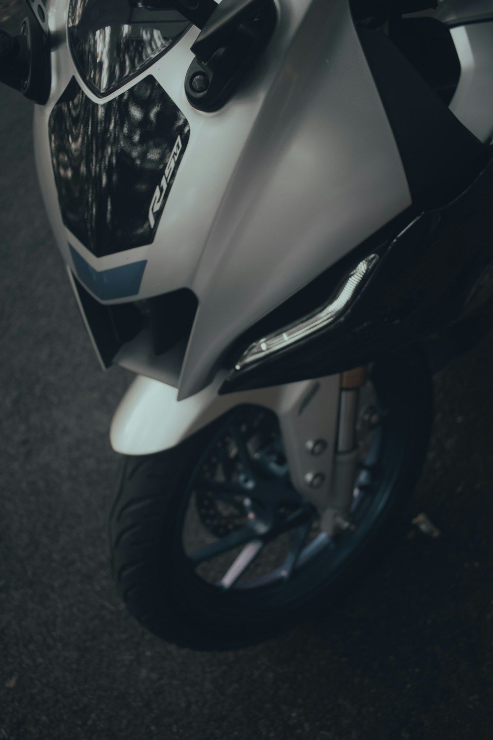 a close up of a motorcycle parked on a street