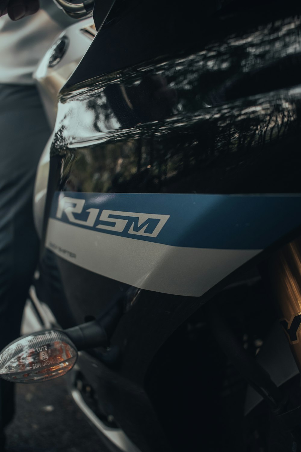 a close up of a motorcycle parked on a street