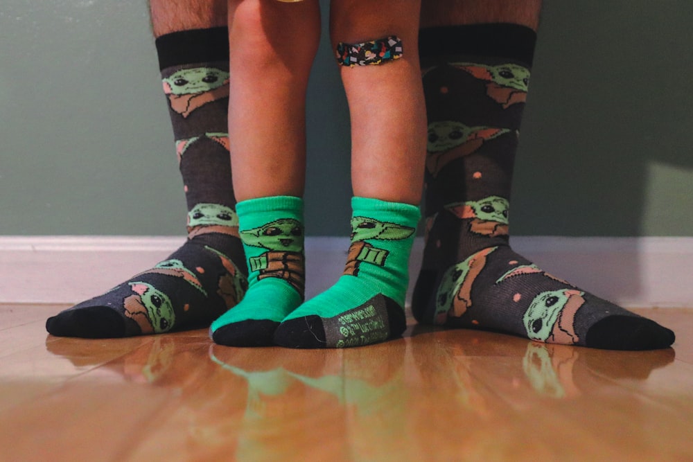 a pair of feet wearing star wars socks