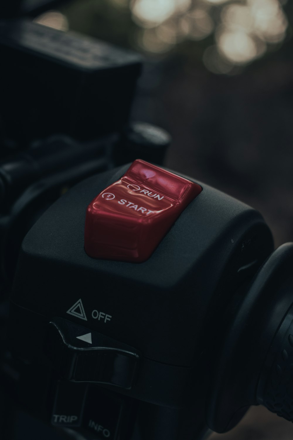 a close up of a camera with a red button