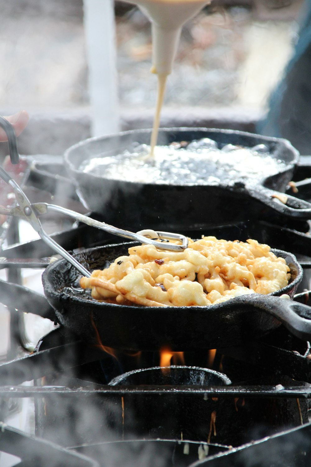 a close up of food cooking on a grill