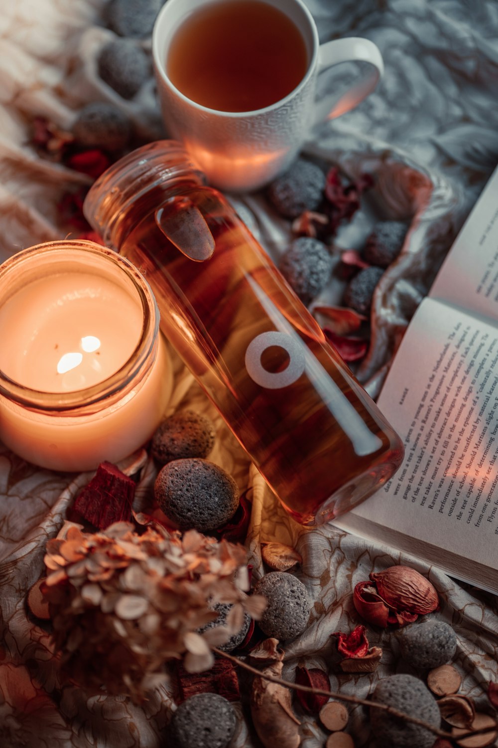 a candle and a book on a table