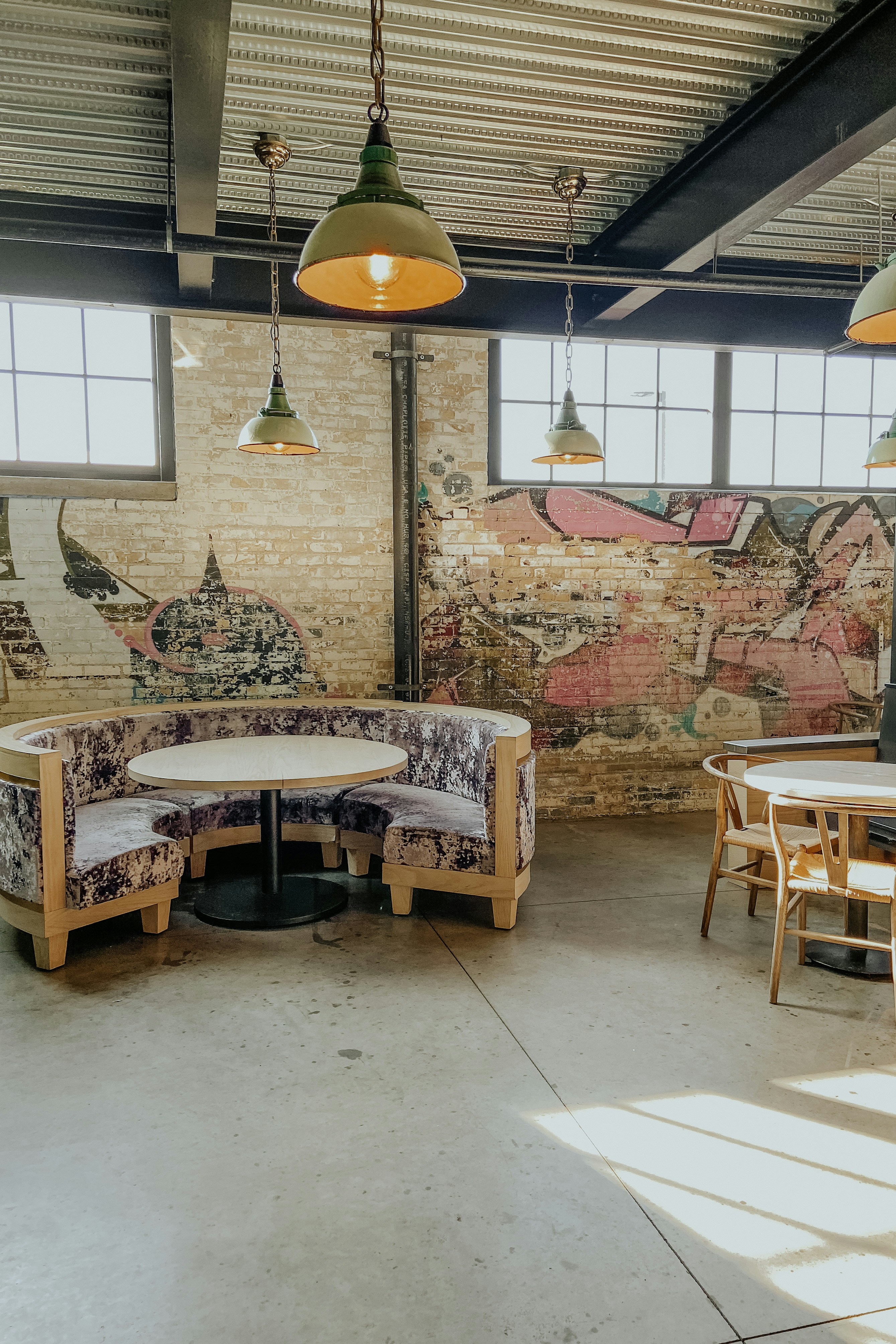 a room with a lot of tables and chairs