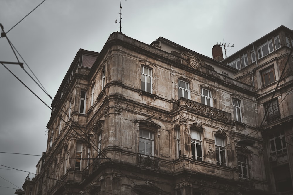 an old building with a clock on the top of it