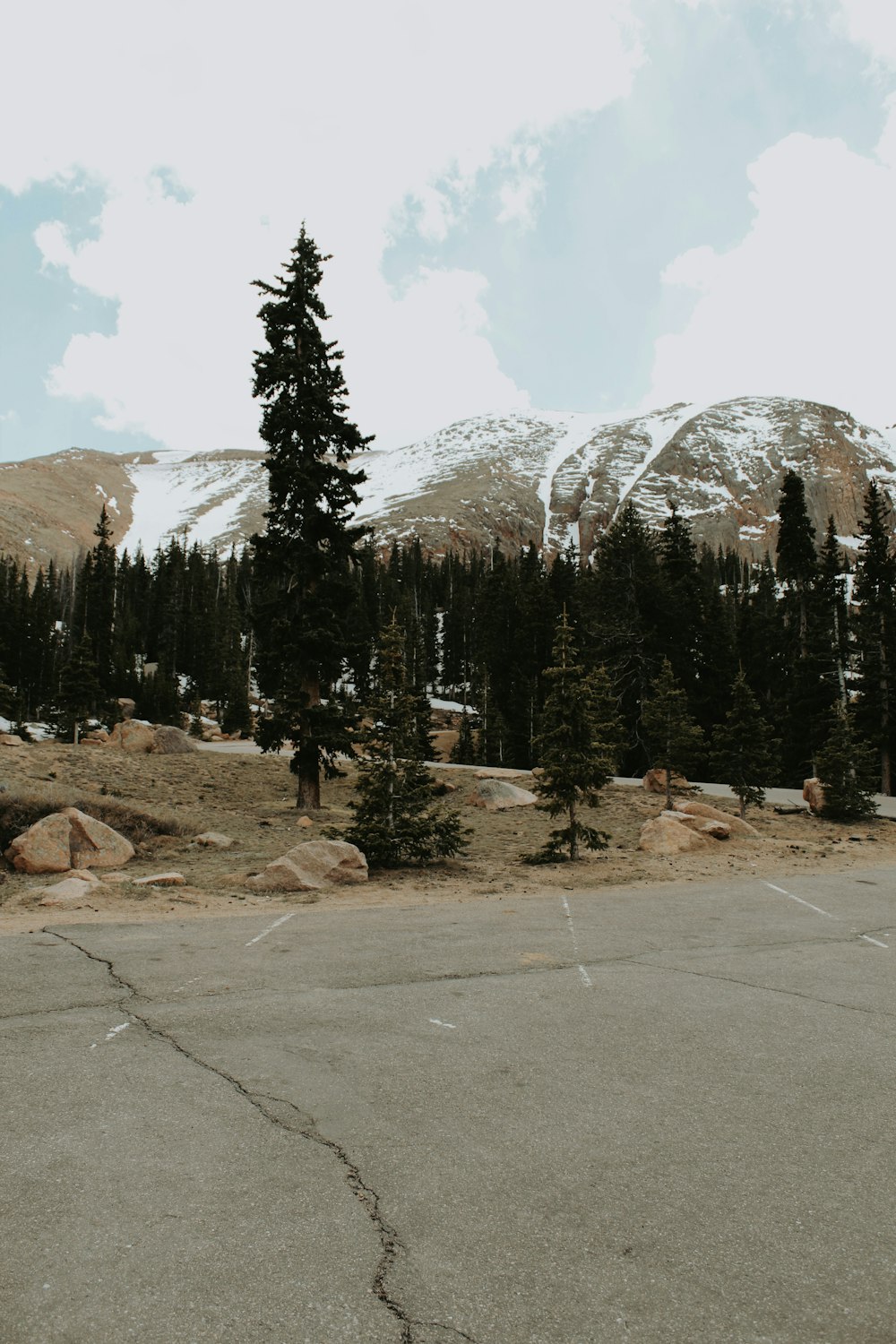 a view of a mountain range from a parking lot