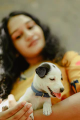 A family warmly welcoming a newly adopted puppy into their home.
