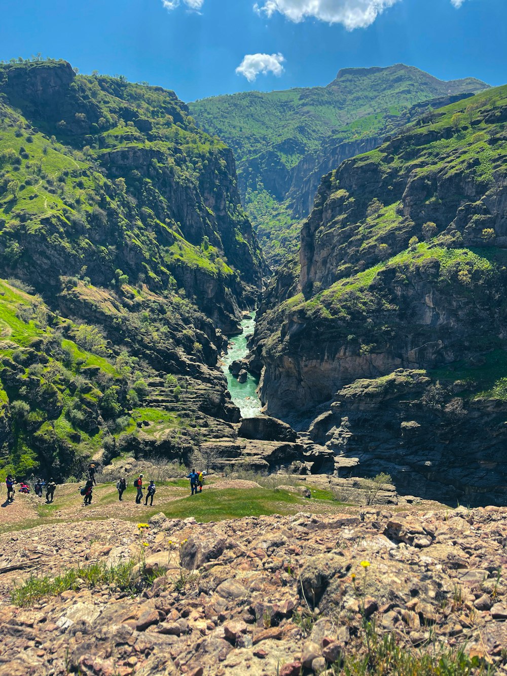 a group of people hiking up a mountain side