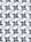 a black and white tiled wall with a pattern of stars