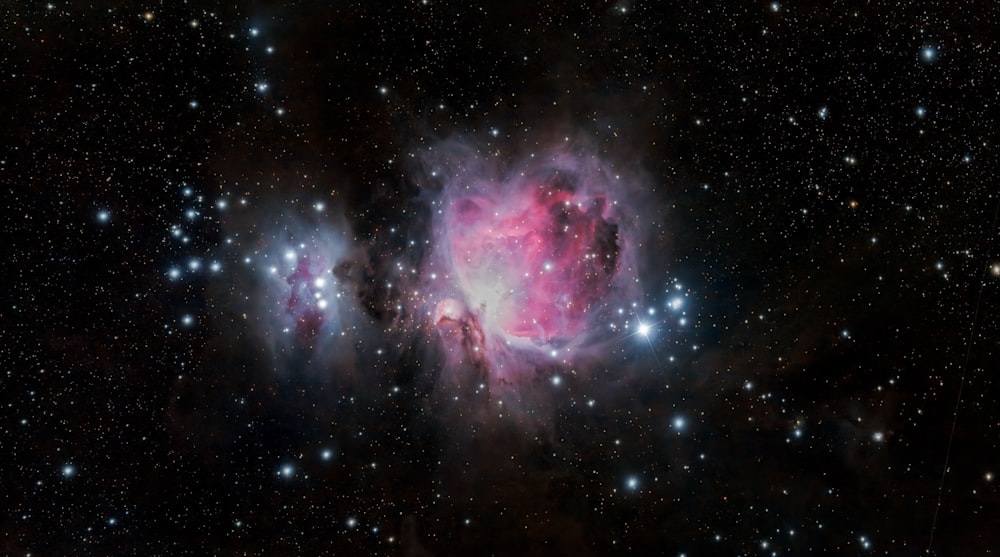 a large star cluster in the middle of a night sky