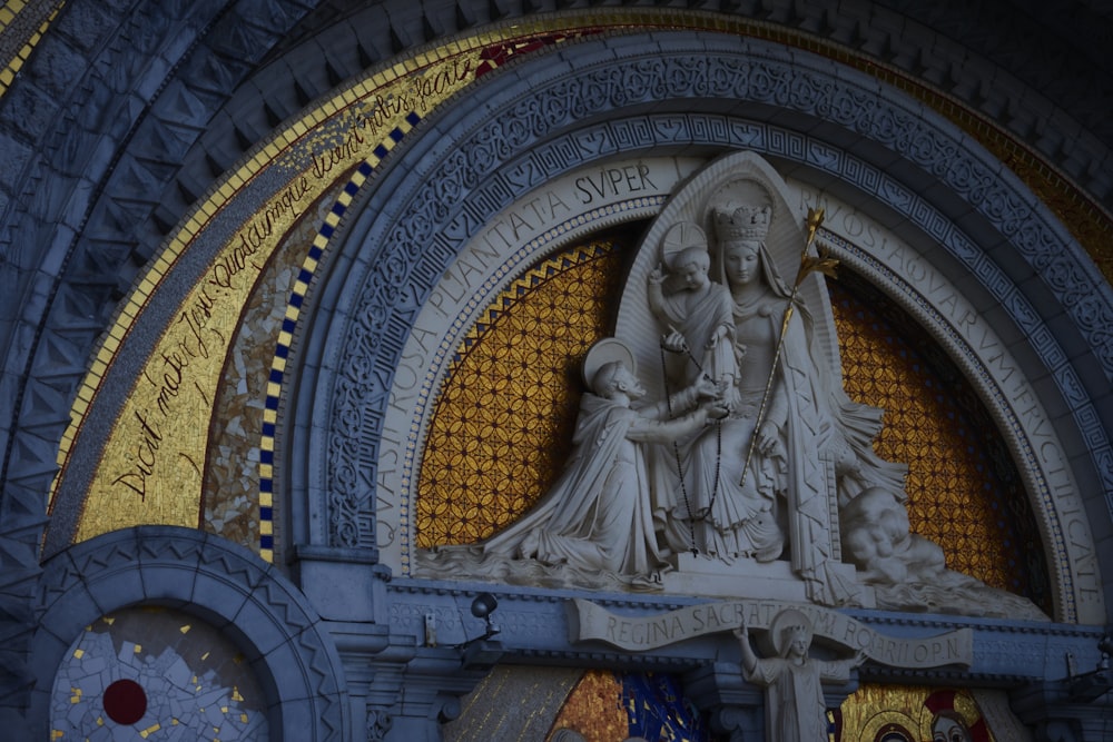 a statue of a woman holding a child