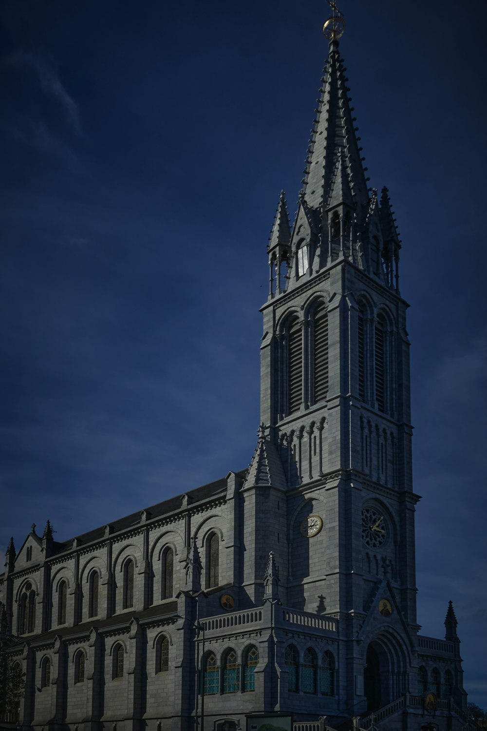 a very tall building with a clock on it's side