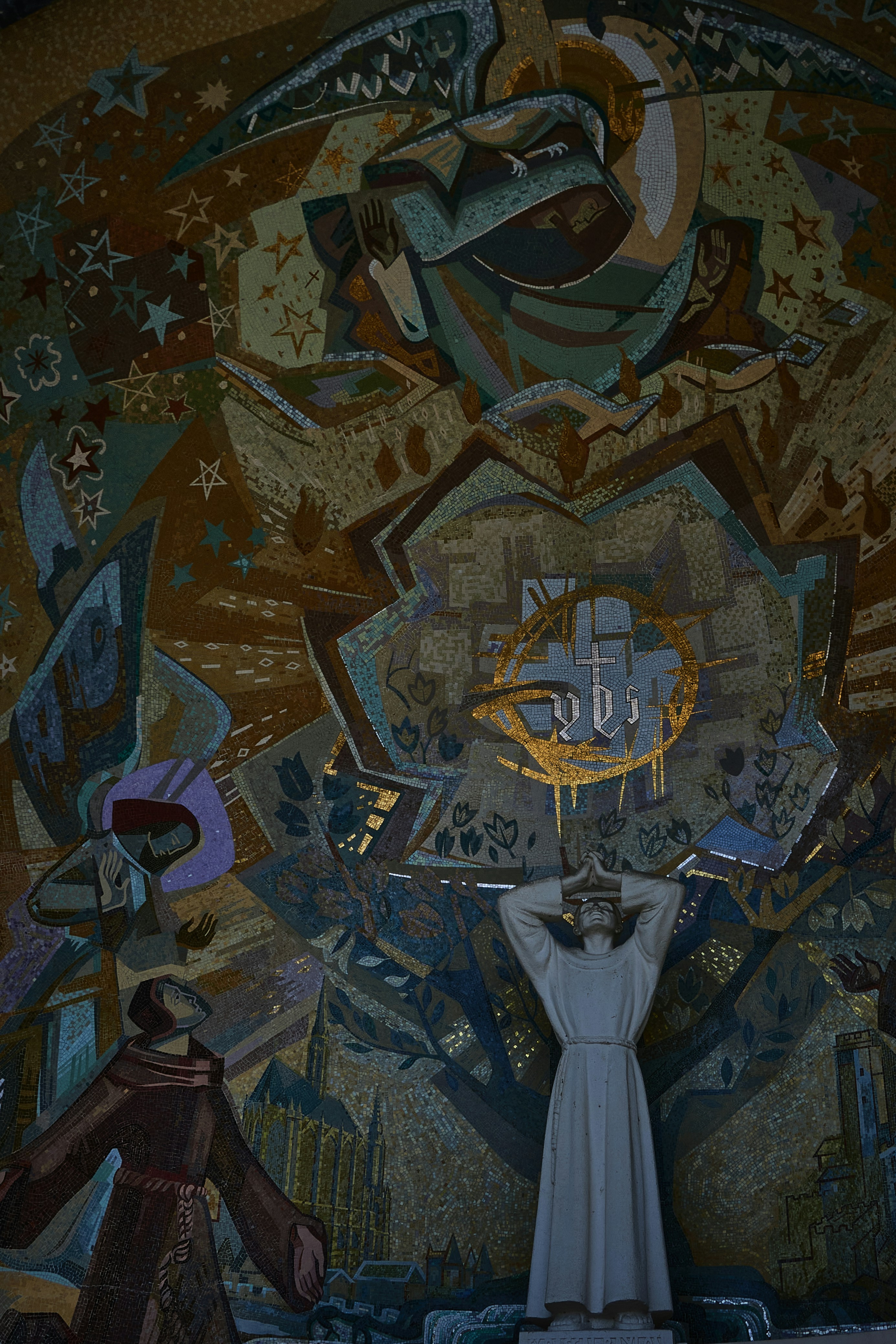 a person standing in front of a painting on a wall