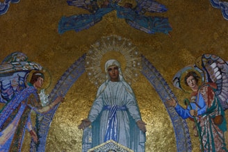 a painting of jesus surrounded by angels on a wall