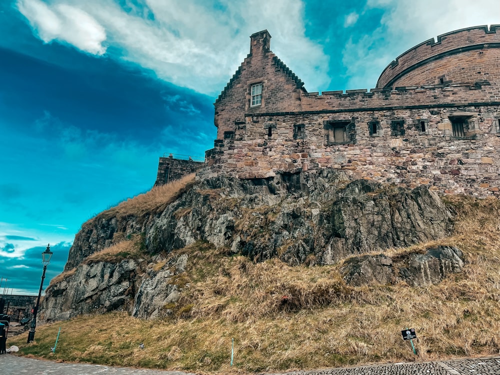 a large stone castle sitting on top of a hill