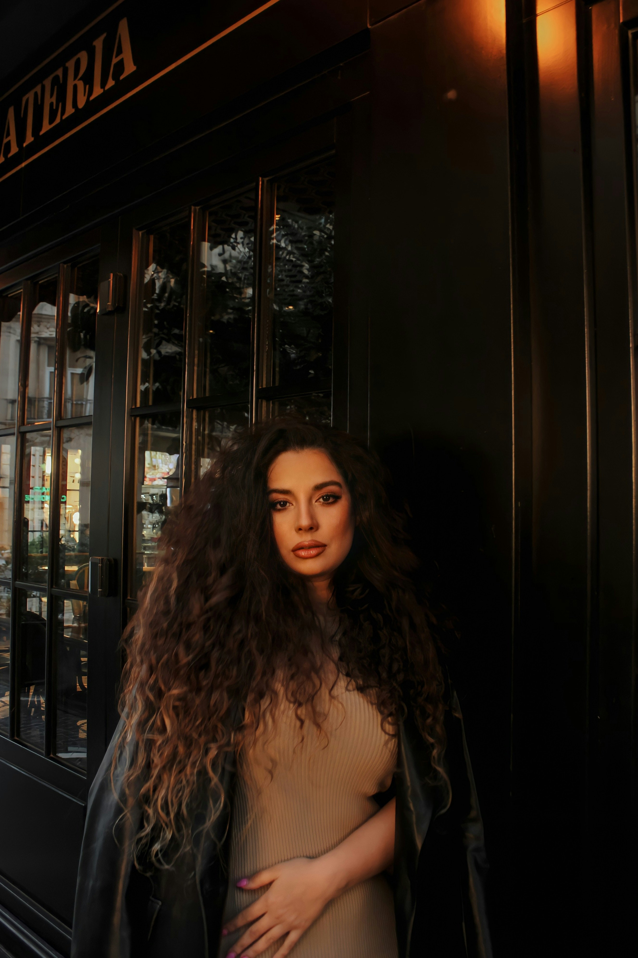 a woman standing in front of a building