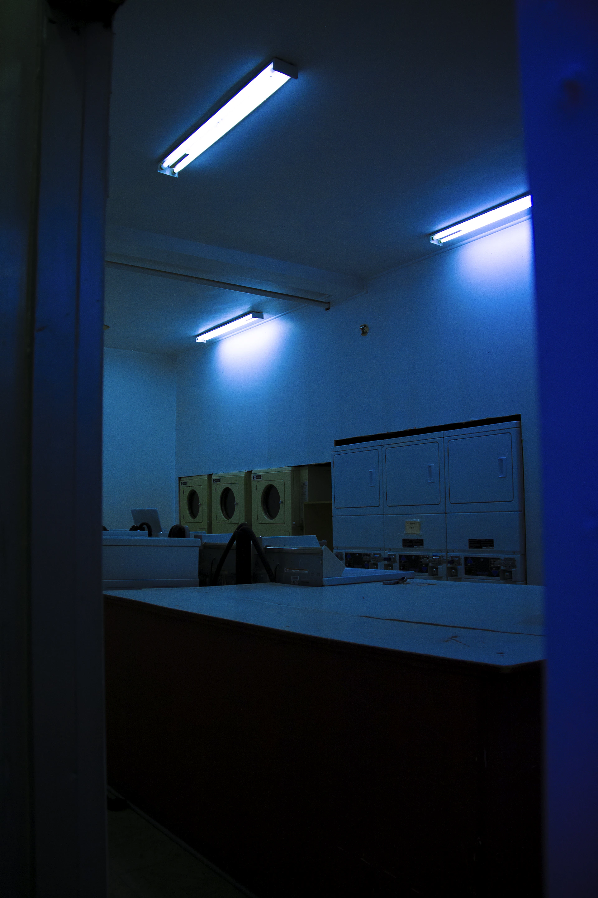 a room with a lot of cabinets and lights