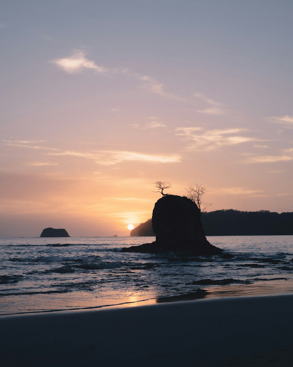 a sunset over a body of water