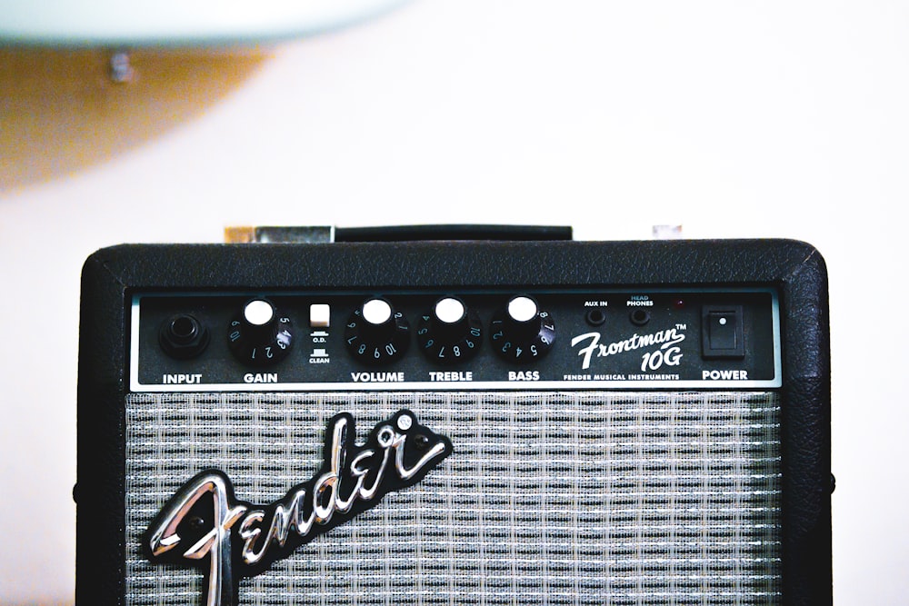 a fender guitar amplifier sitting on top of a table