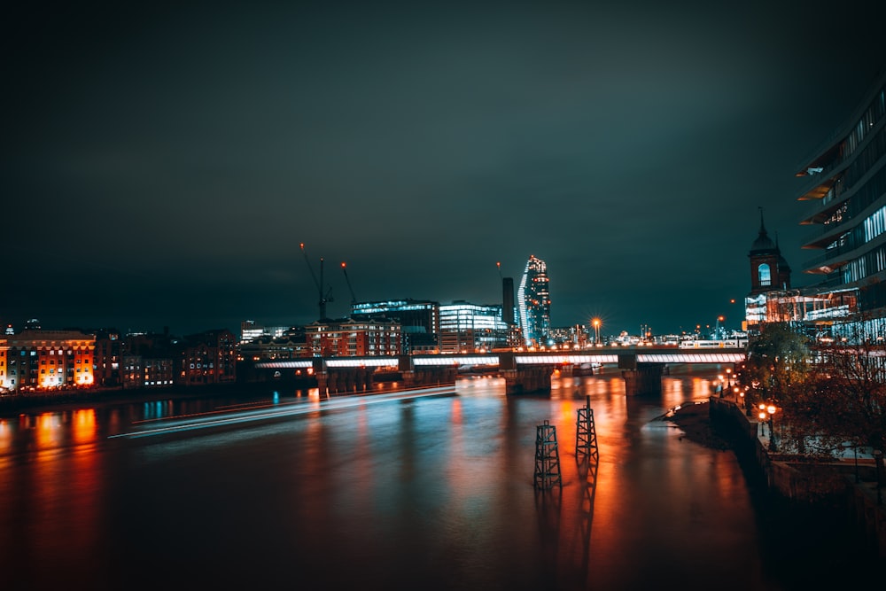 a view of a city at night from across the river