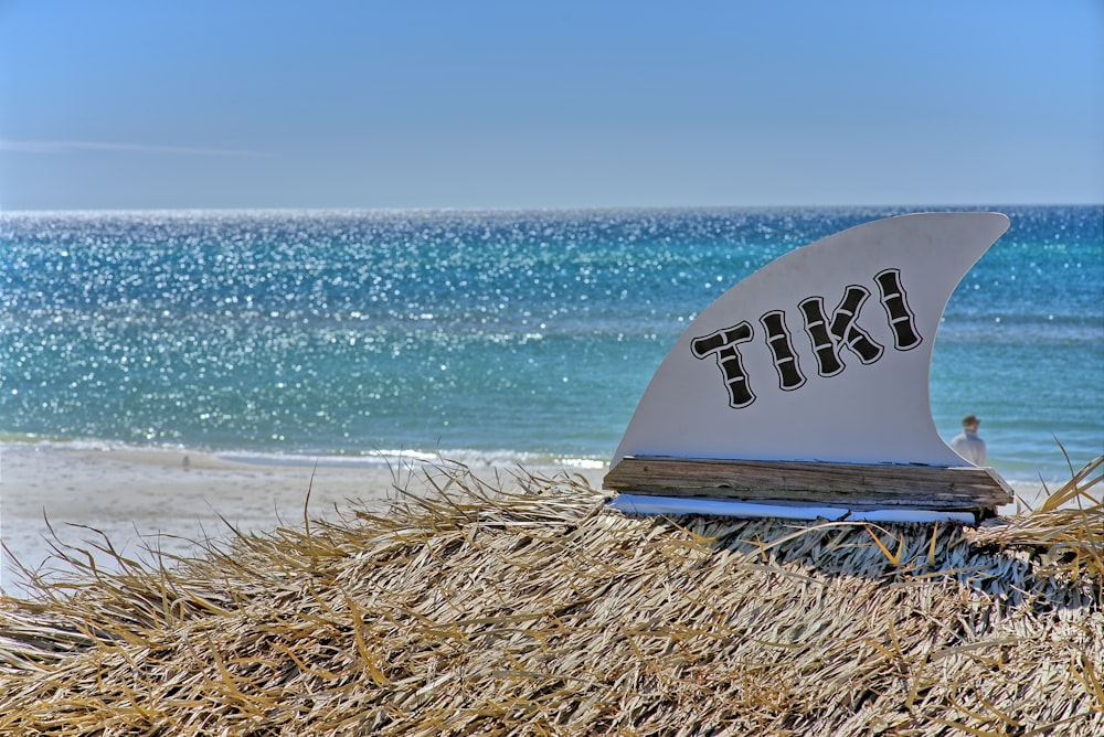 a surfboard that is laying on a beach