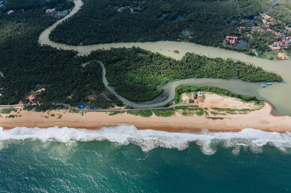 an aerial view of a sandy beach and ocean