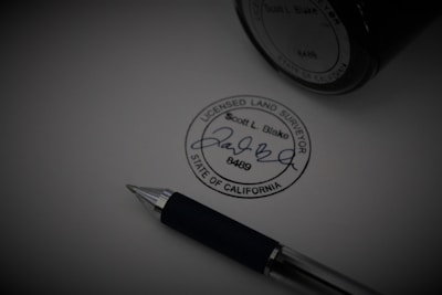 a pen sitting on top of a piece of paper