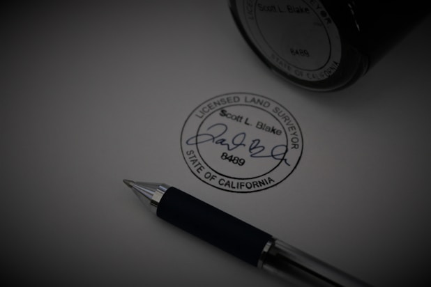 a pen sitting on top of a piece of paper