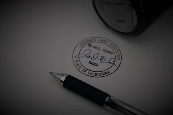 a pen sitting on top of a piece of paper