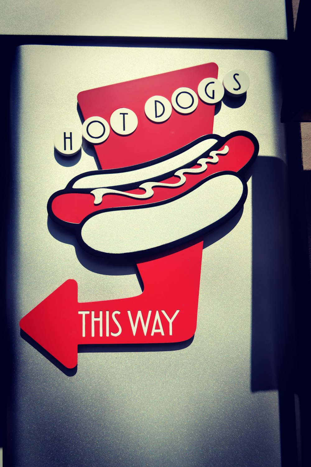 a hot dog sign with a hot dog on it