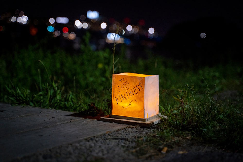 a paper bag with writing on it sitting on the ground