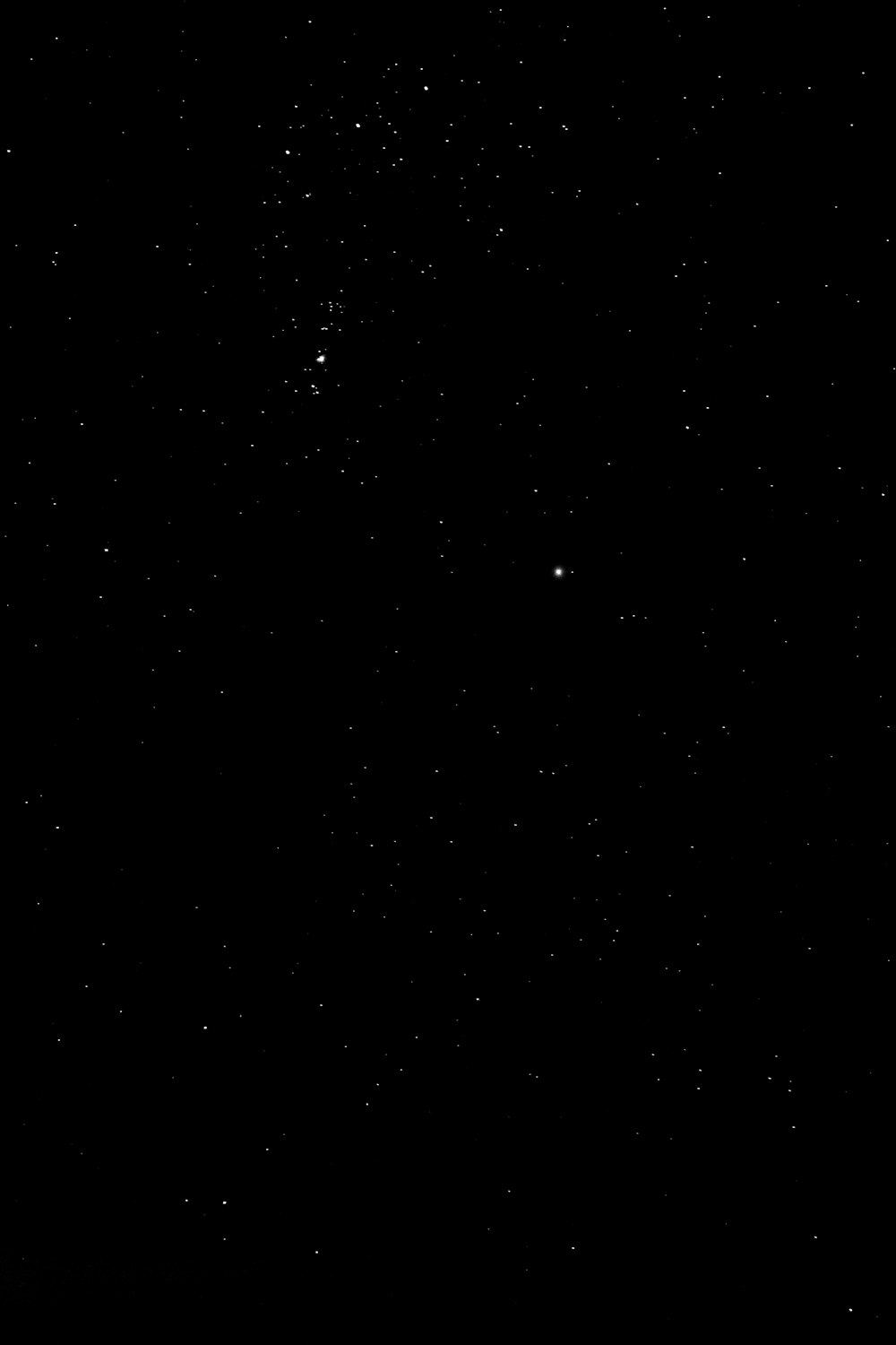 a black sky with a few stars in it