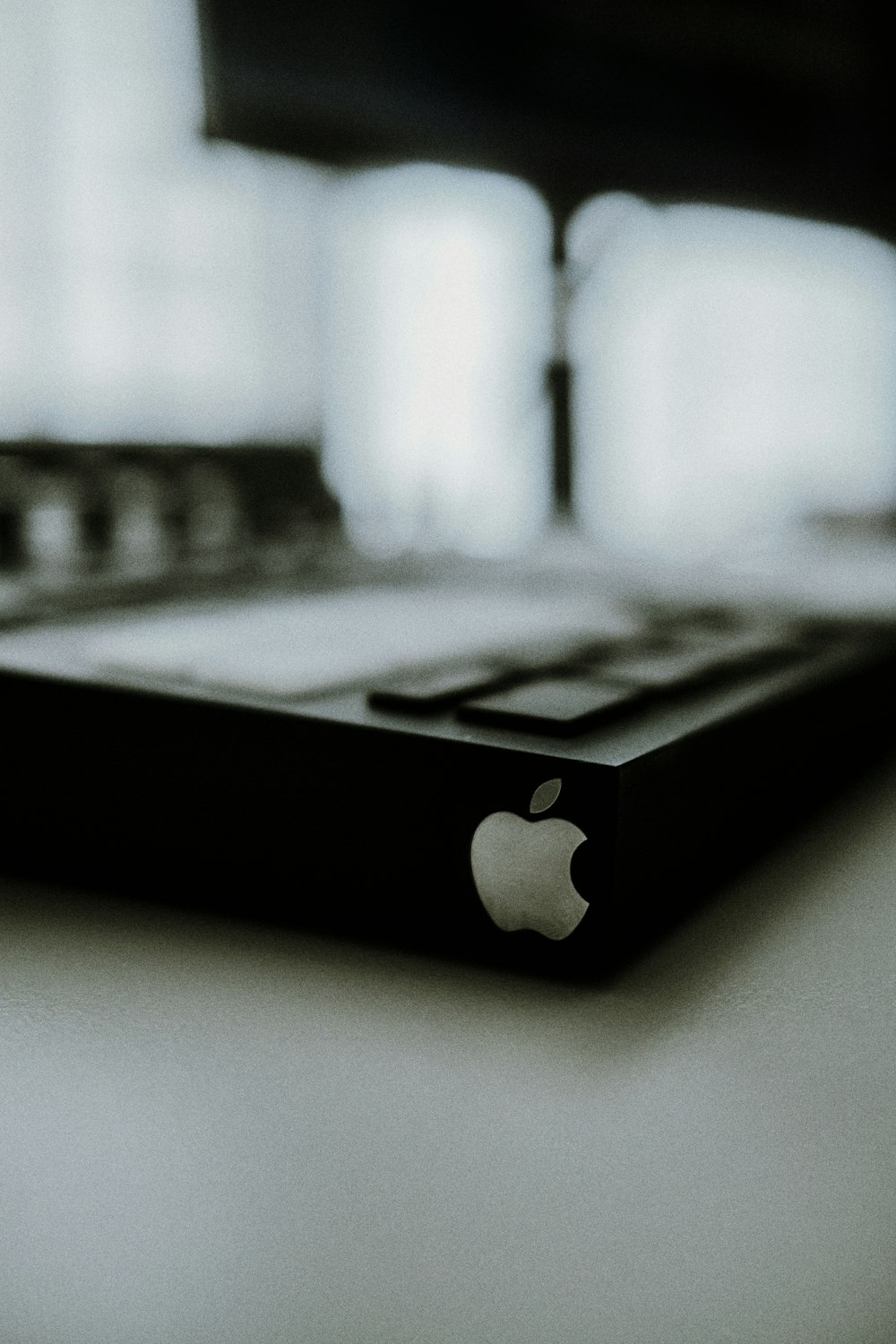 a black and white photo of an apple computer