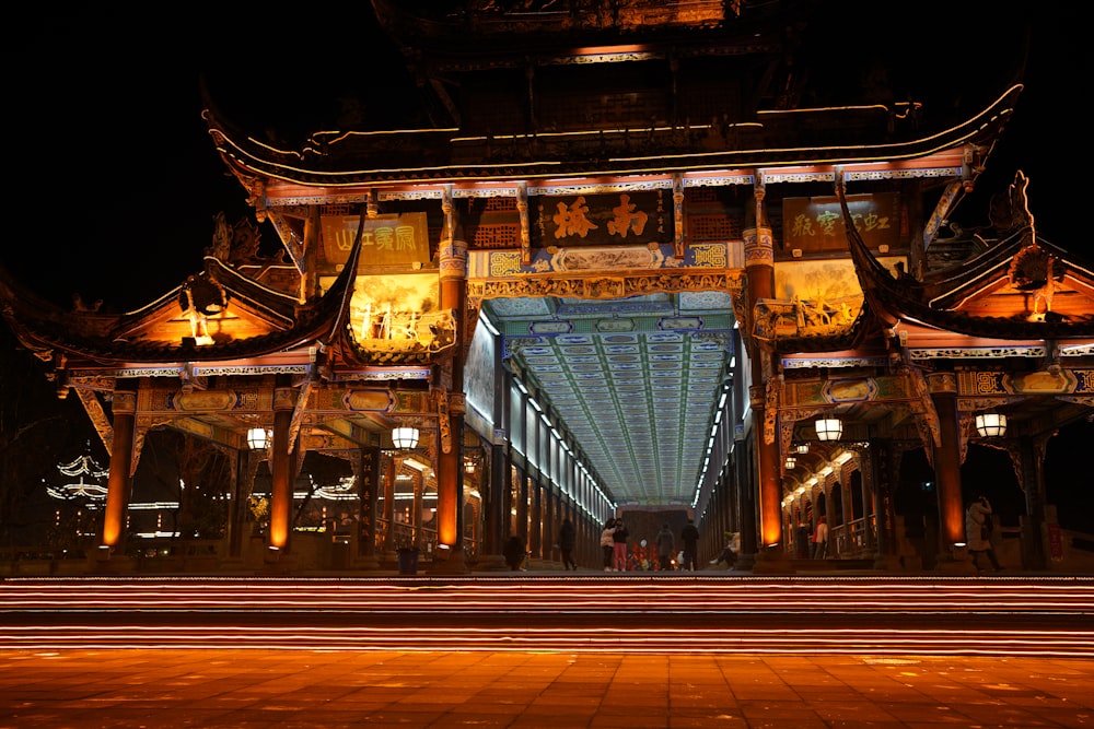 a large building lit up with lights at night