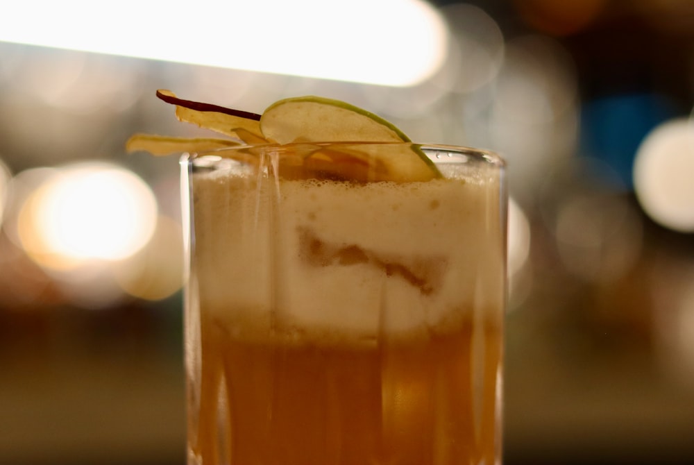 a close up of a drink in a glass on a table