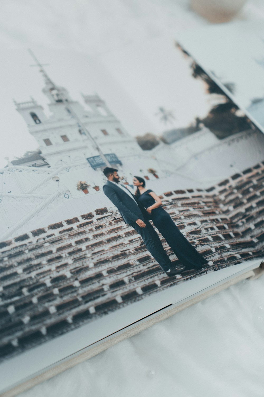 a couple of people that are standing in front of a picture