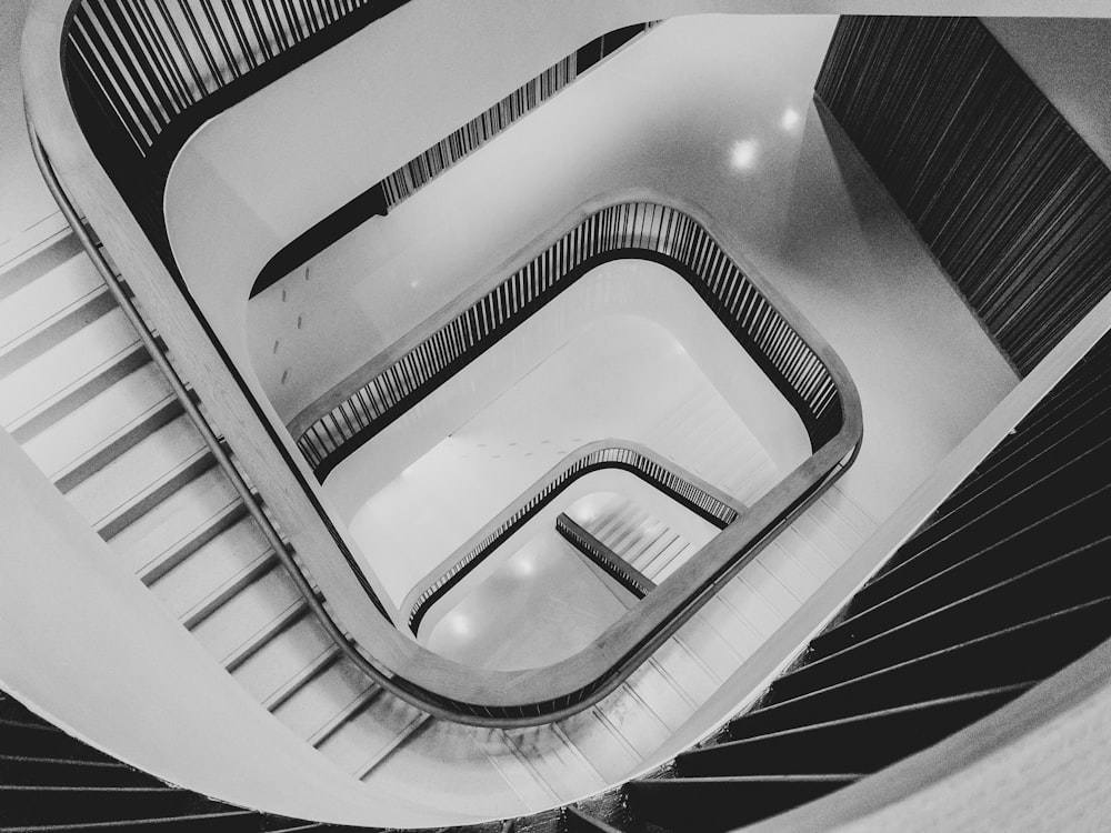 a black and white photo of an escalator