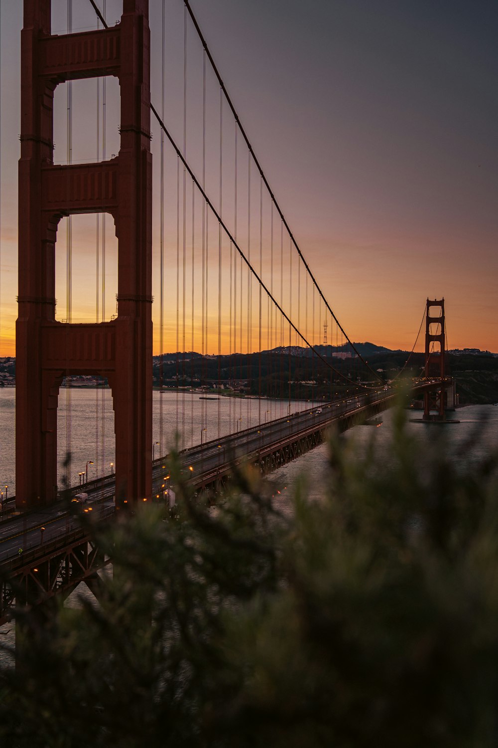 a view of the golden gate bridge at sunset