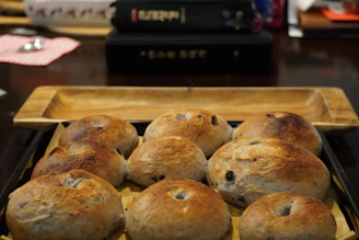 a tray filled with rolls sitting on top of a table