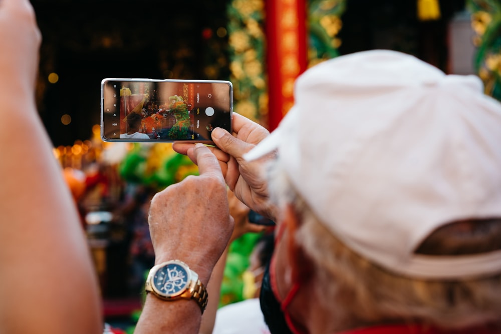 a man taking a picture with his cell phone