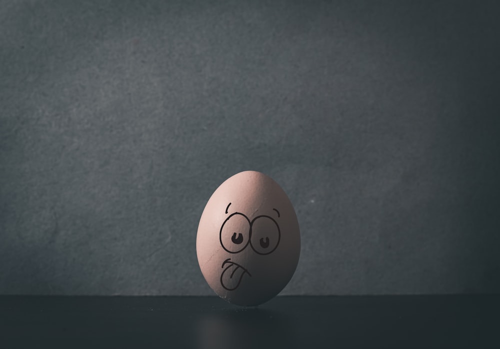 an egg with a face drawn on it