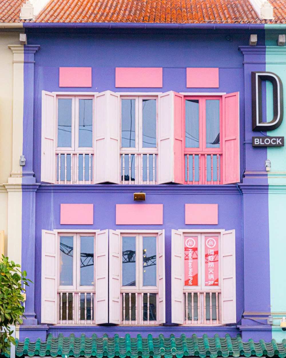 a multi - colored building with a clock on the front of it