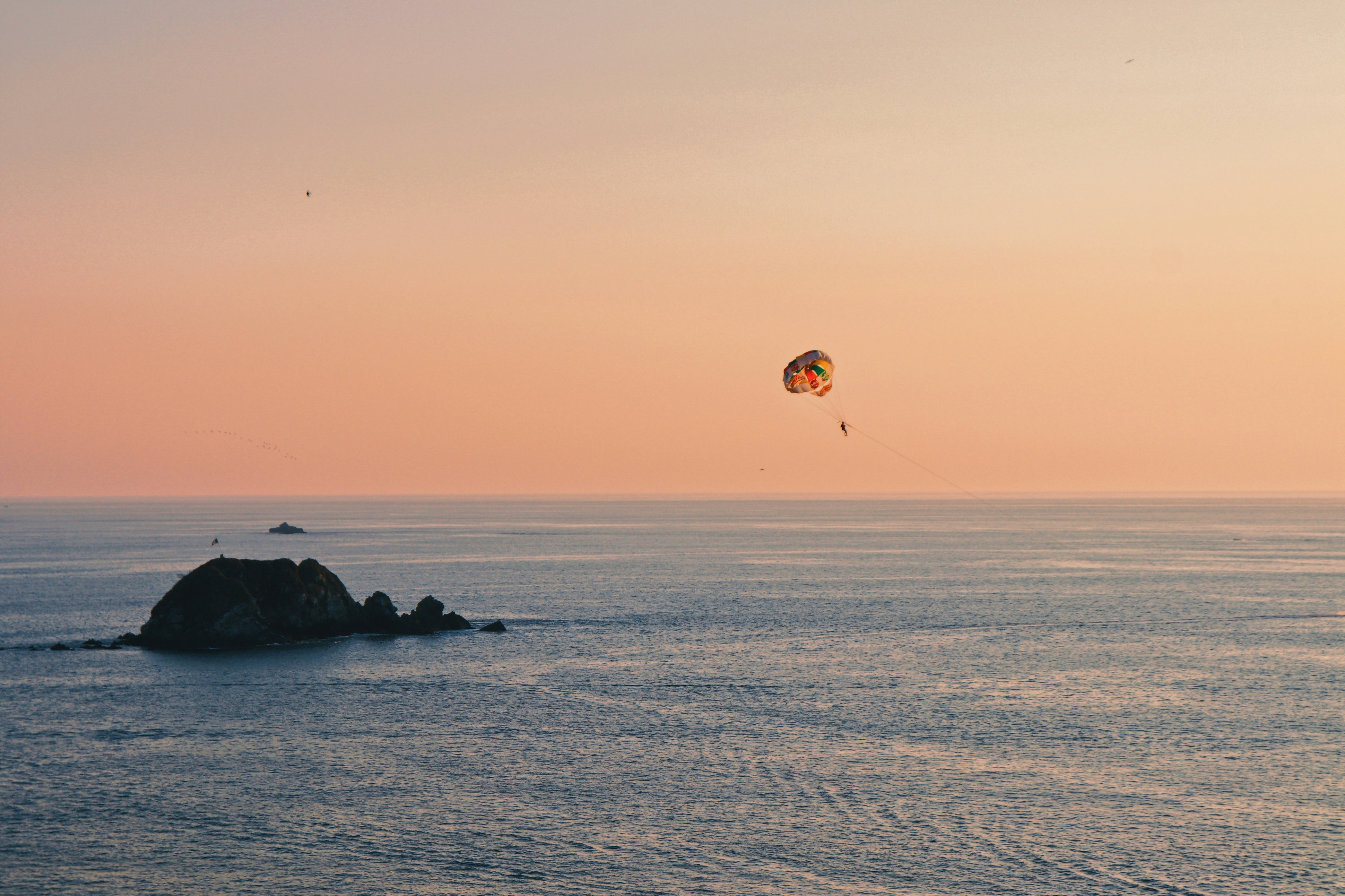 a kite flying over a body of water