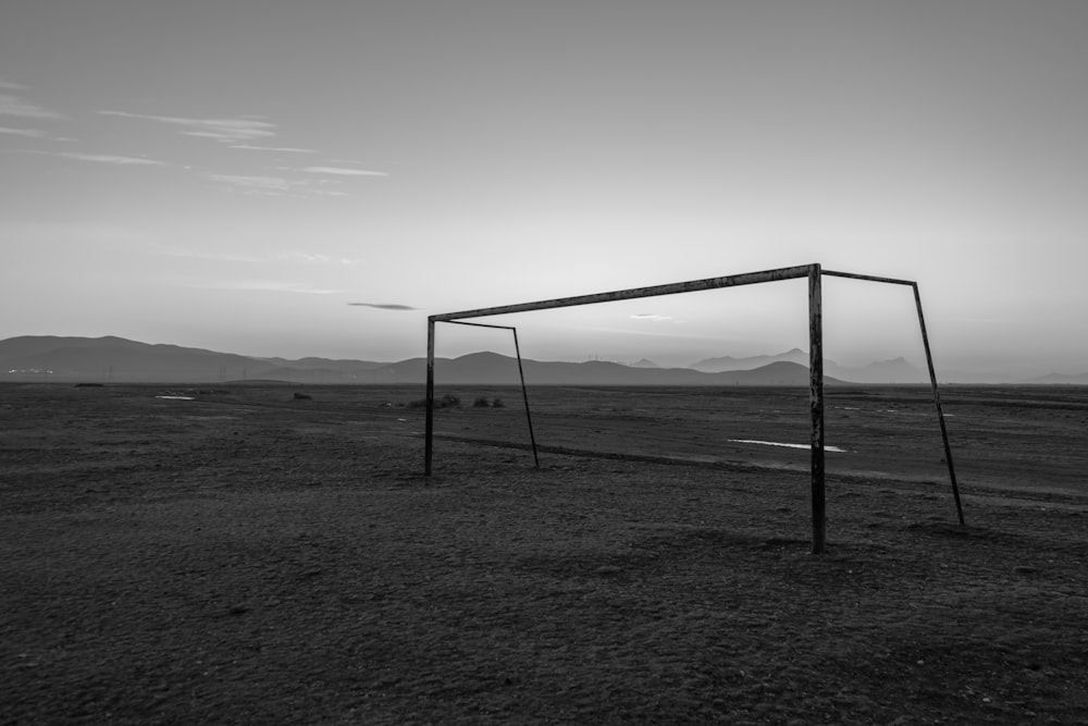 a black and white photo of a soccer goal