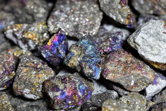 a pile of colorful rocks sitting next to each other