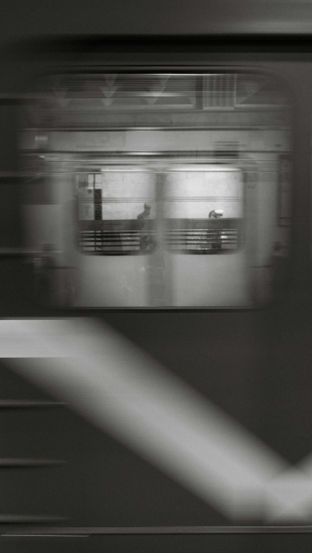 a black and white photo of a subway train