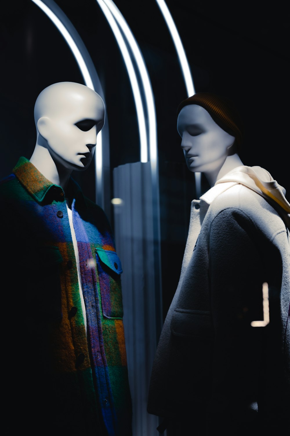 a couple of mannequins standing next to each other