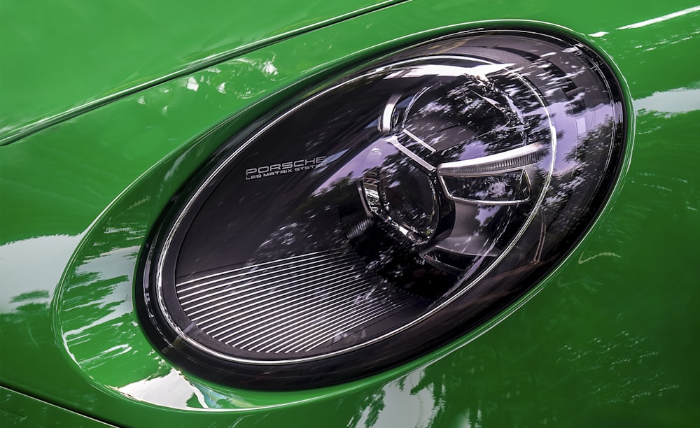 a close up of a green car's taillight