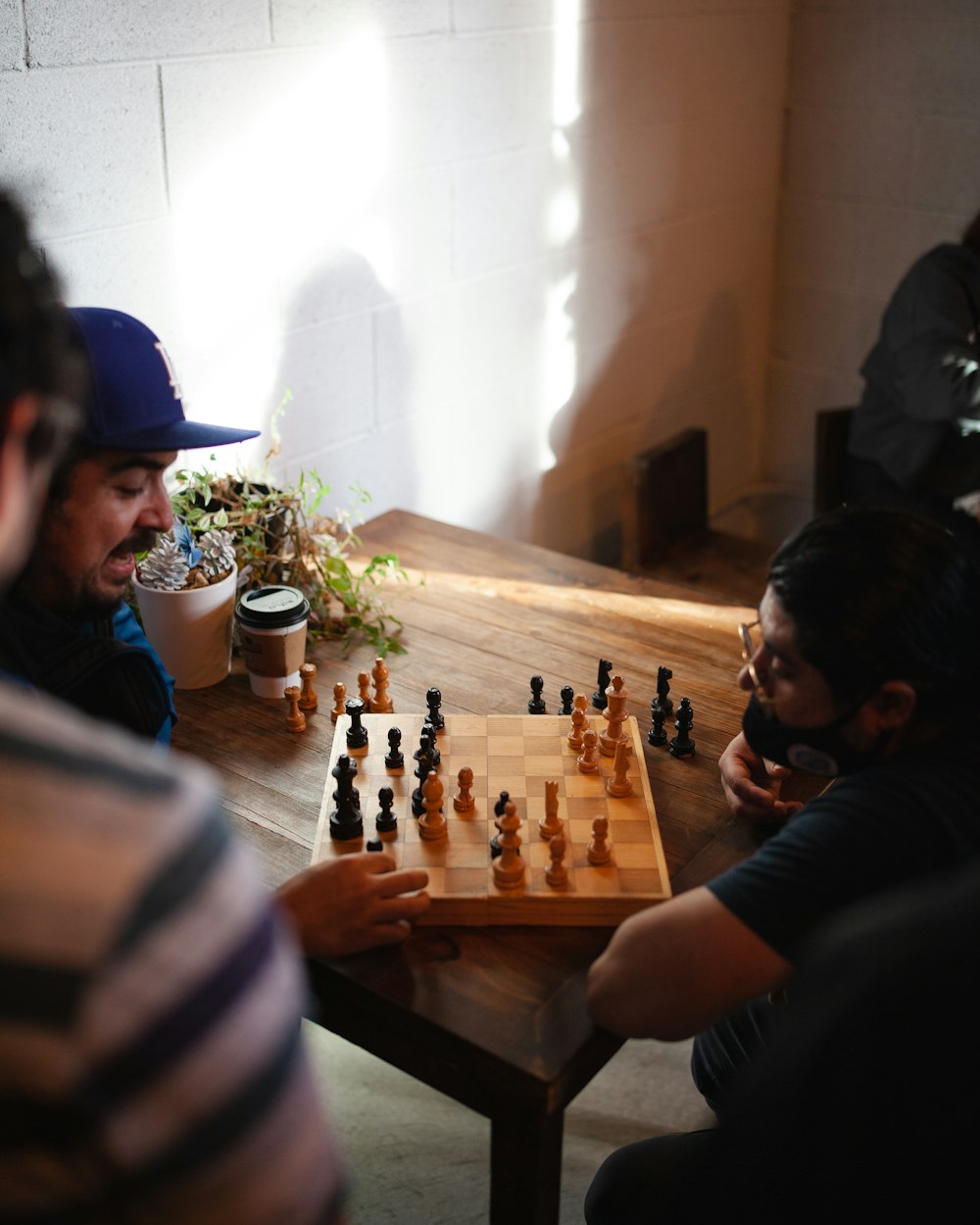 a group of people playing a game of chess