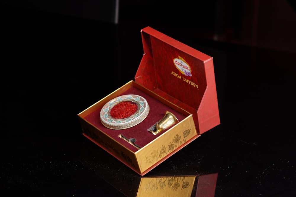 a red box with a silver object inside of it