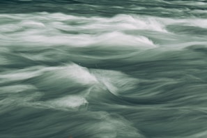 Stylized wave patterns flowing smoothly with parallax effect